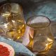 a glass and a fruit on a table Sweet Wines From Around the World